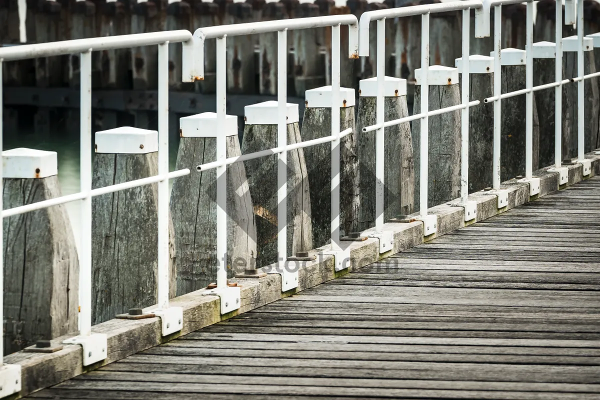 Picture of Cityscape with water view and picket fence barrier.