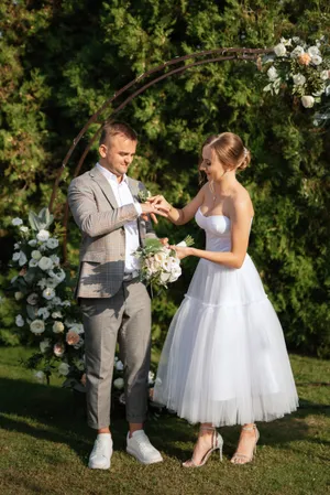 Happy wedding couple outdoors, smiling and celebrating love.