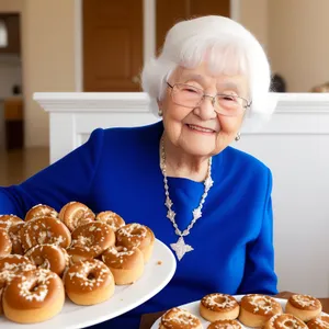 Smiling Grandma Enjoying Delicious Fried Cake