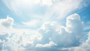 Bright summer sky landscape with fluffy clouds.