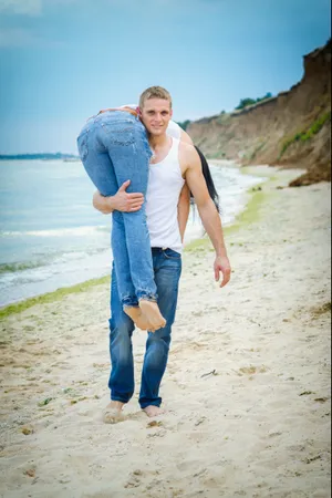 Happy Couple Enjoying Summer Vacation on the Beach