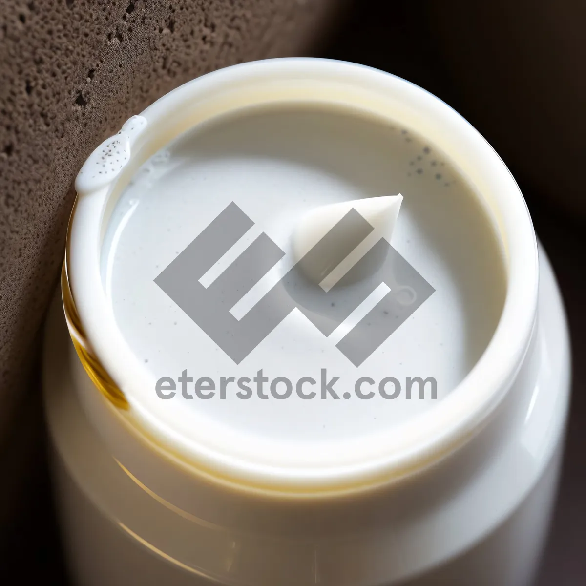 Picture of Delicious Café-Style Hot Beverage with Cream and Spoon