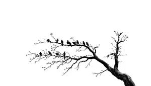 Silhouette of tree branches against a sunset sky.