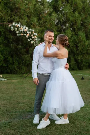 Happy newlyweds embrace on their wedding day.