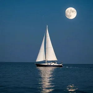 Sailboat Sailing Under a Full Moon