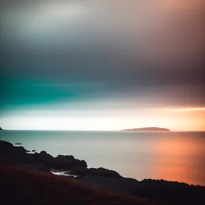 Golden Horizon: Majestic Sunset over Mountain Landscape