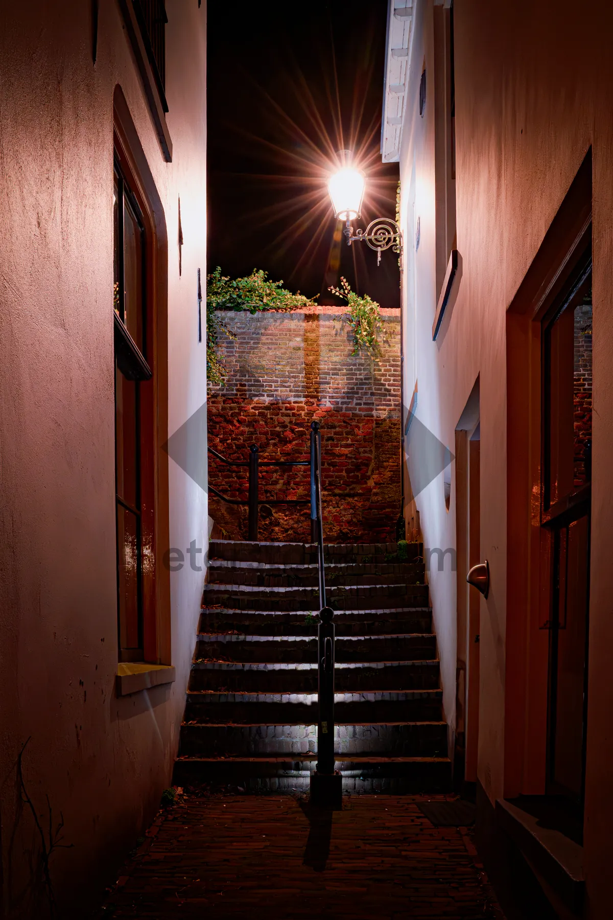 Picture of Ancient stone building with old door in city.