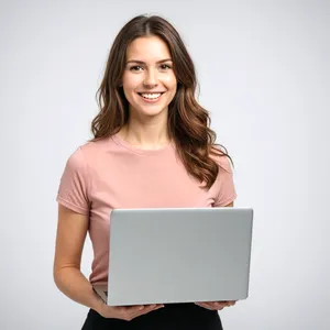 Smiling Businesswoman with Laptop at Desk