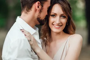 Attractive couple smiling together in love and happiness.