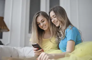 Happy young couple smiling at home together