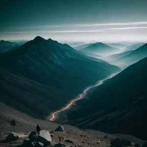 Majestic Highland Sunset Over Snow-Capped Mountains