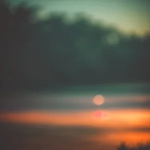Vibrant Sunset Sky with Clouds and Sunlight