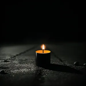 Radiant Candle Glow Flickering in Darkness