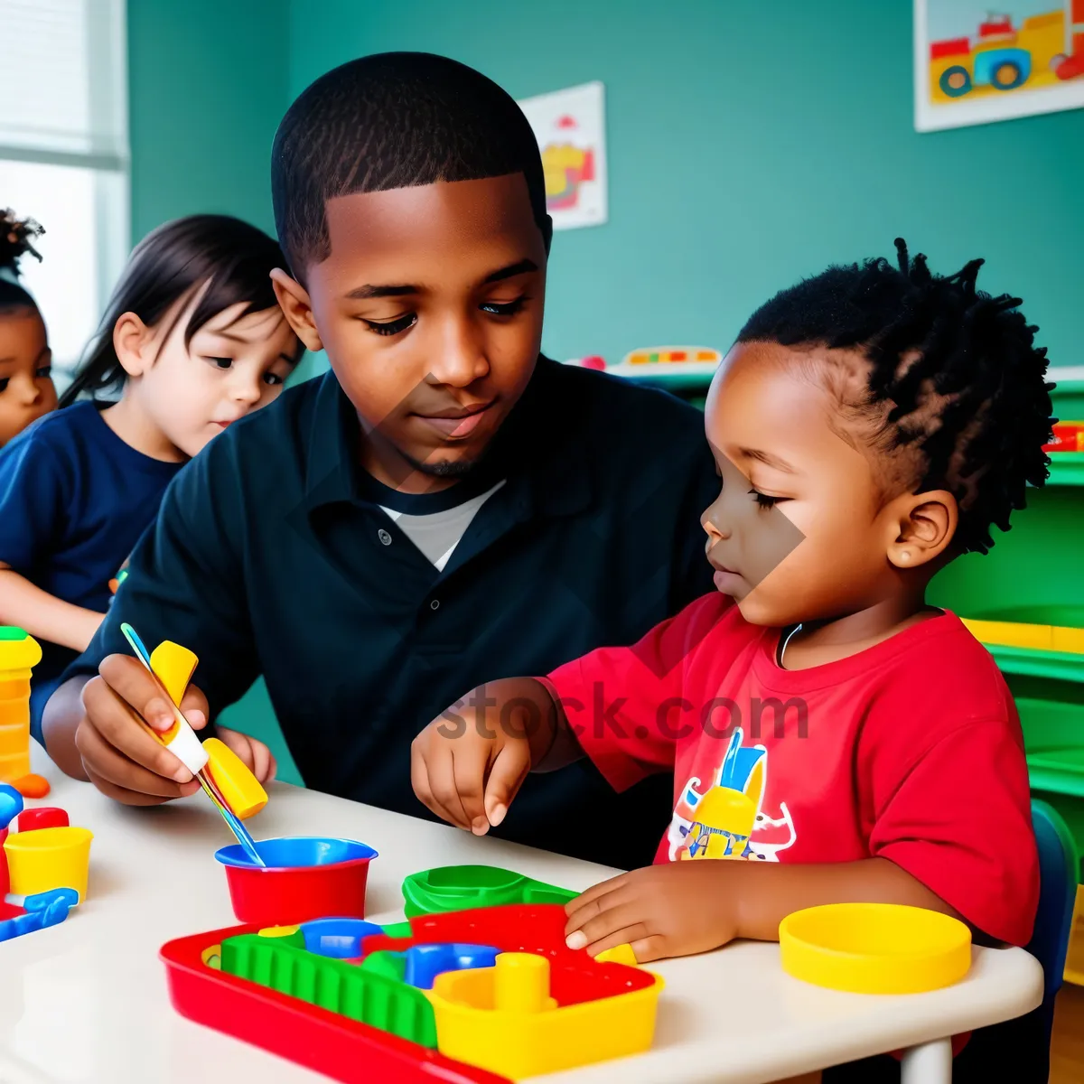 Picture of Cheerful schoolboy happily sitting in classroom