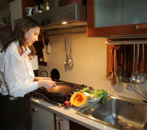 Modern kitchen interior with waffle iron on stove