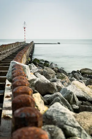 Ocean Waves Crash Against Barrier Rocks - Seascape