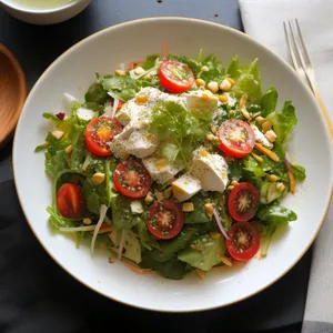 Delicious Gourmet Salad with Fresh Vegetables and Sauce
