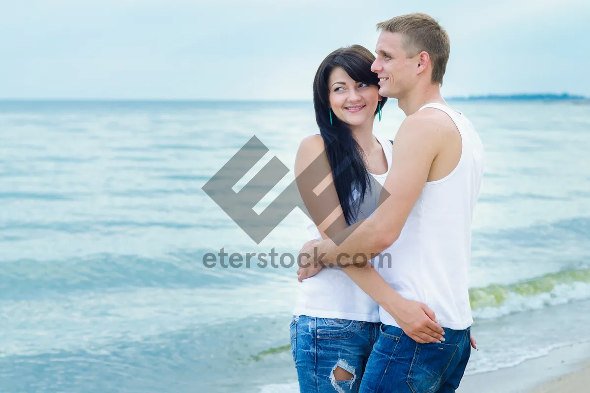 Picture of Happy couple in swimsuits at tropical beach