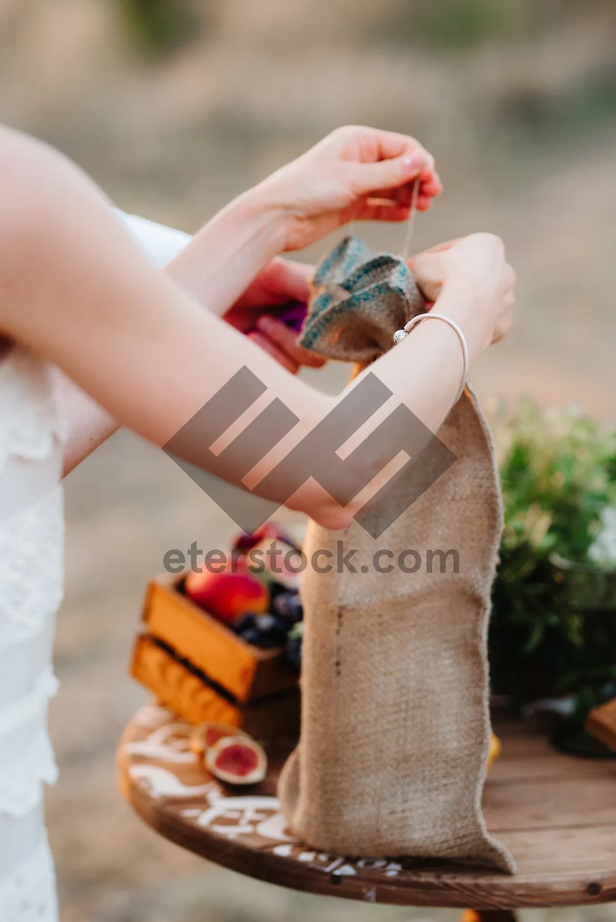 Picture of Adult hand holding lighter with cigarette, smoking.