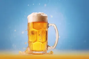 Golden beer in frosty mug with bubbles.