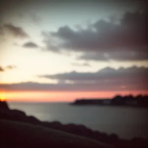 Golden Horizon: Reflecting Silhouette on Ocean