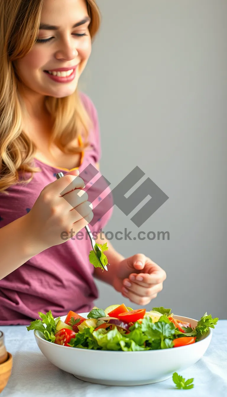 Picture of Happy smiling woman holding a book