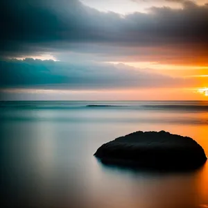 Serenity at Dusk: Ocean Sunset with Silhouette