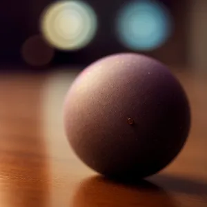 Round Egg-shaped Bowling Ball on Black Table