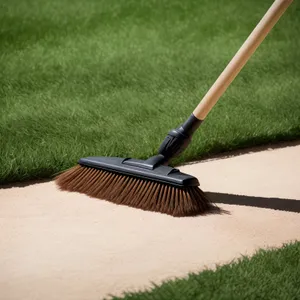 Golf club and ball poised on green