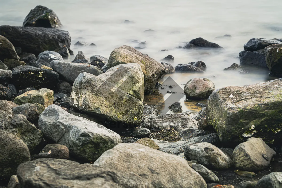 Picture of Skyline view of coastal rock barrier by the sea.