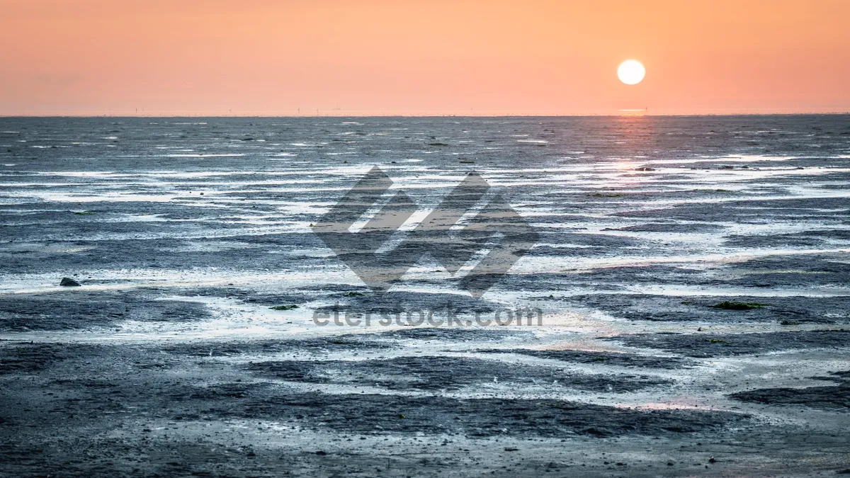 Picture of Tropical Sunset Reflection on Tranquil Beach