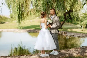 Happy Wedding Couple Outdoors Smiling in the Park