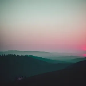 Majestic Mountain Sunset Over Desert Horizon