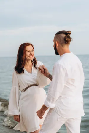 Happy Couple Enjoying Beach Vacation in Summer Sunshine