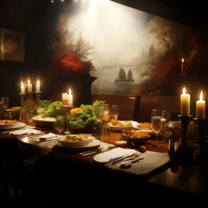 Nighttime dinner celebration at elegant restaurant with candlelight