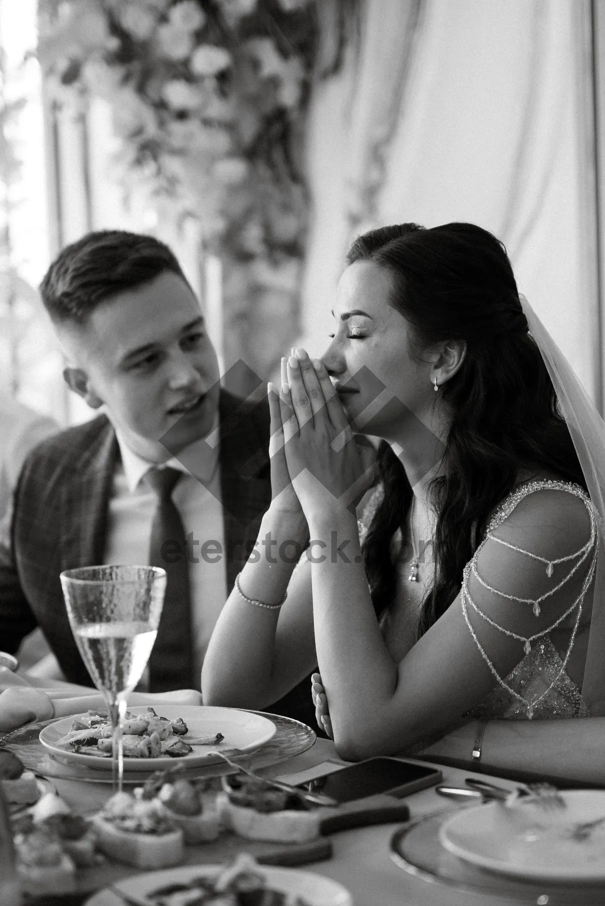 Picture of Happy couple enjoying wine at a restaurant table