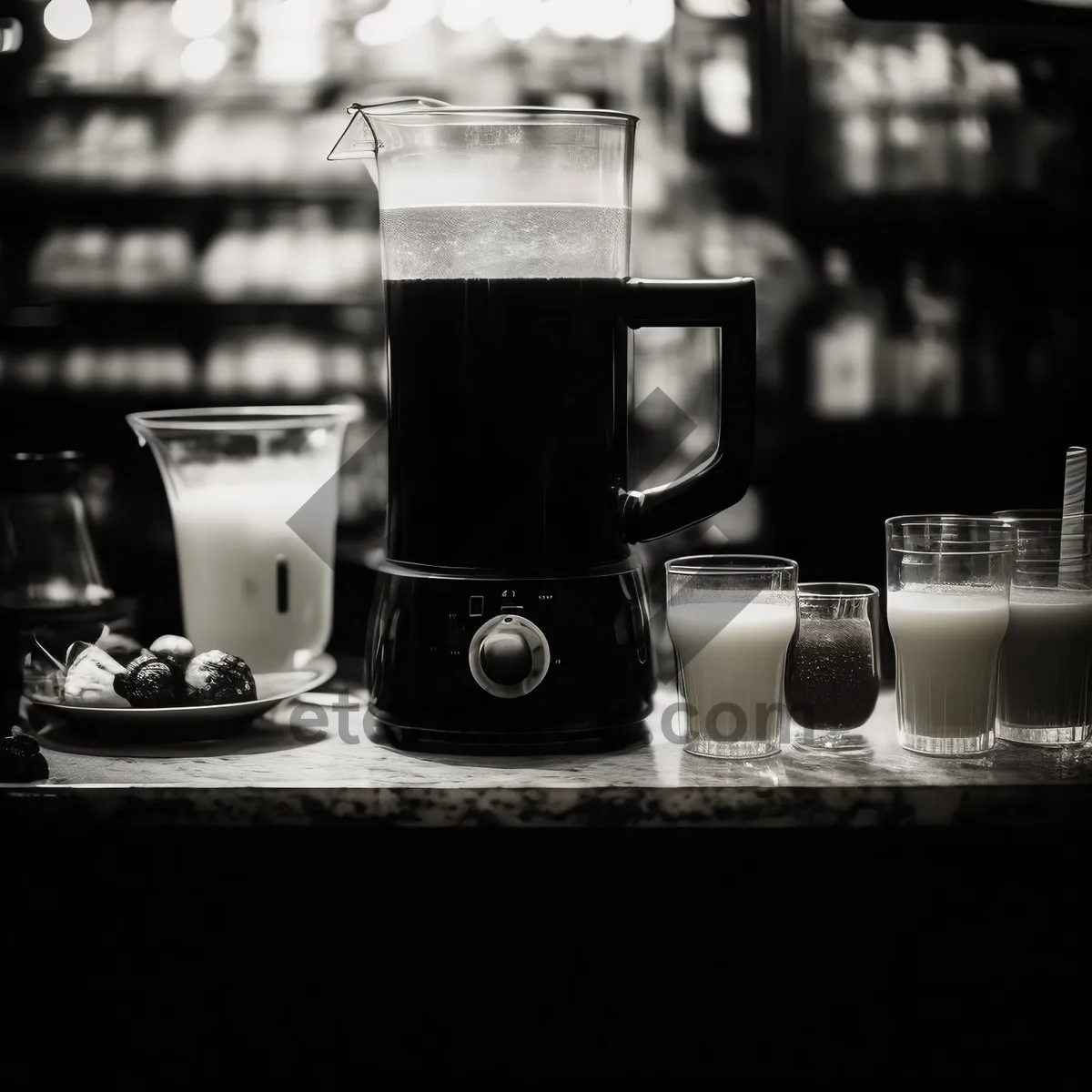 Picture of Glass coffee pot on kitchen counter top with cup