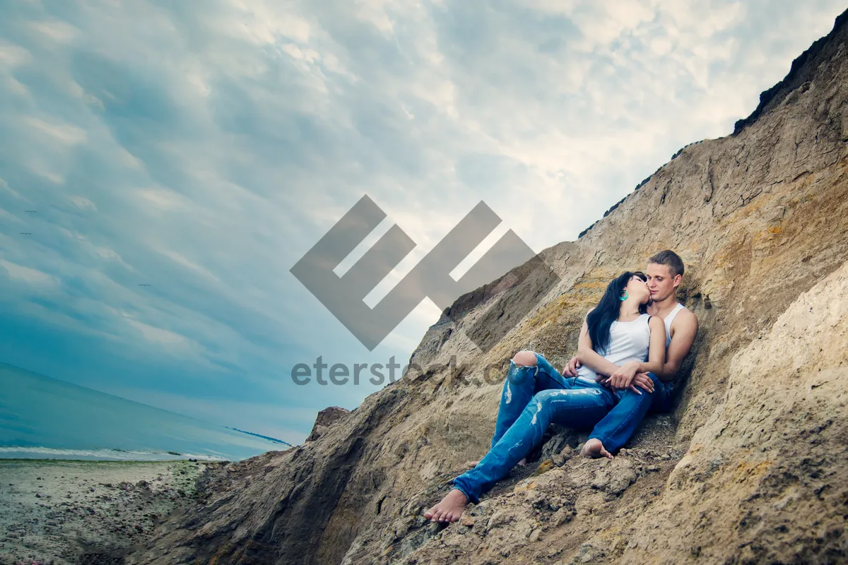 Picture of Mountain landscape with rocky cliff and sloping hill.