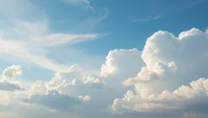 Bright sunny summer landscape with fluffy clouds.