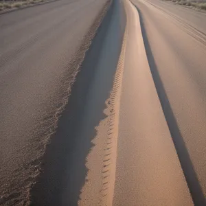 Serene Desert Highway Under Vast Azure Sky