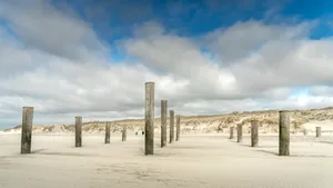 Beach Pier Under Cloudy Sky by the Ocean