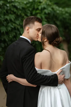 Loving Couple in Wedding Attire Smiling Outdoors