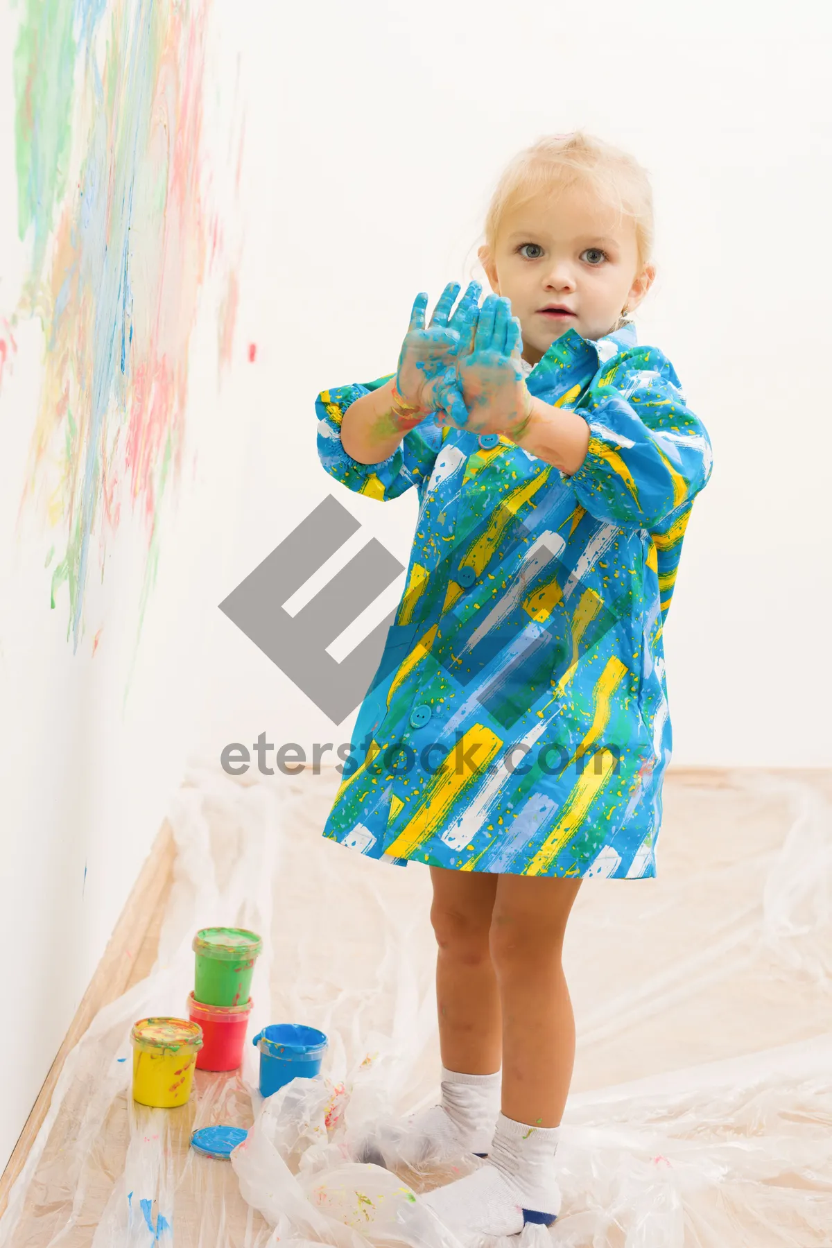 Picture of Happy smiling child portrait with toy in studio