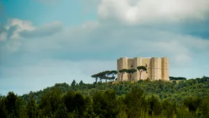 Ancient Stone Castle Tower in Historic Landscape Sky