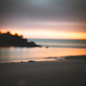 Ethereal Sunset Over Calm Ocean