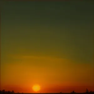 Golden Horizon: Sunset Sky with Silhouetted Celestial Bodies