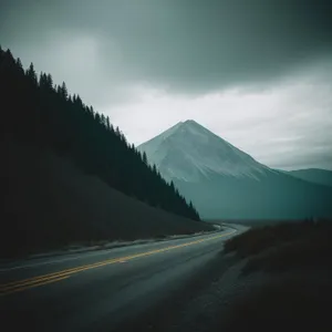 Serene Alpine Highway amidst Majestic Mountain Range