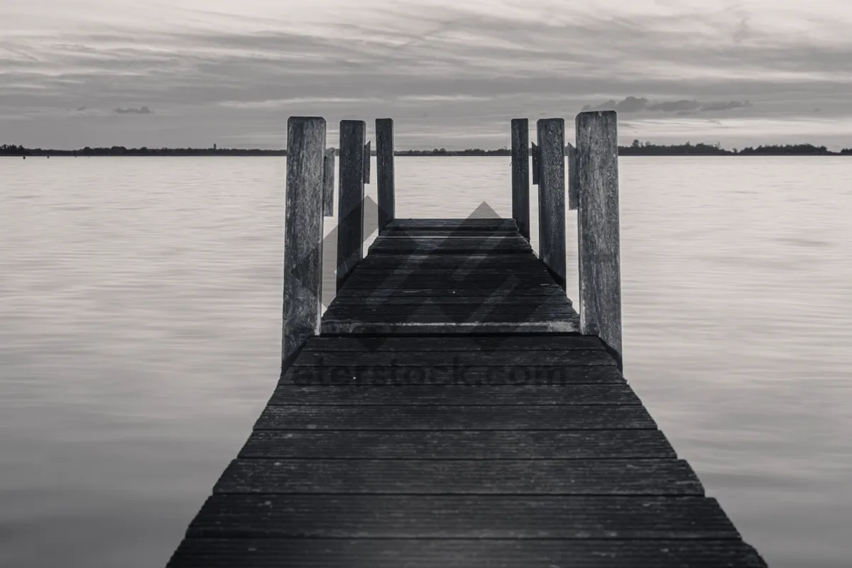 Picture of Wooden pier on tropical beach overlooking serene ocean view