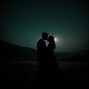 Romantic Sunset Silhouette of Newlyweds on the Beach