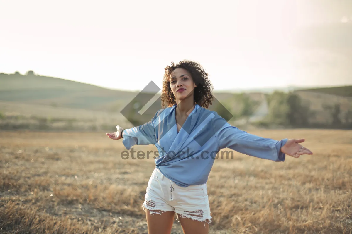 Picture of Happy man smiling outdoors in a summer meadow